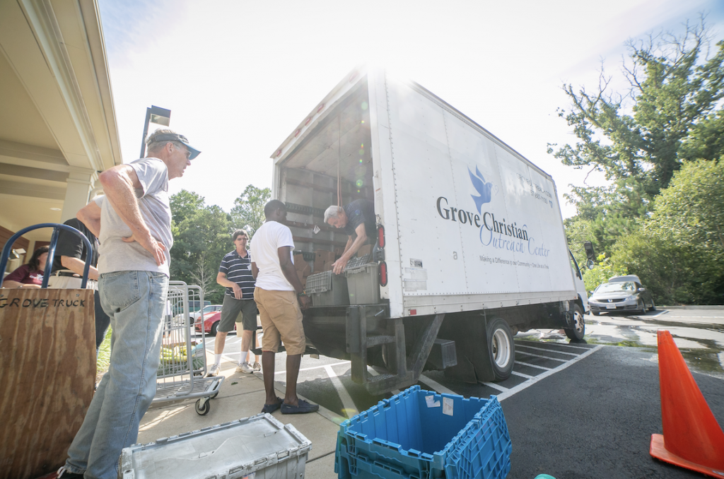 A truck with food donation from local supermarkets arrives for distribution to those in need