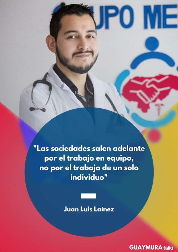 Dr. Juan Lainez standing with a lab coat