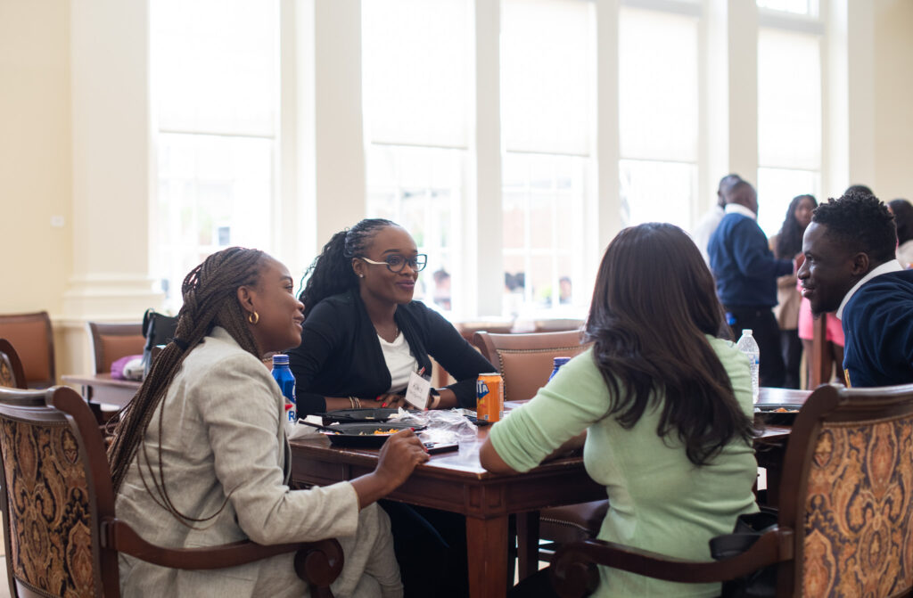 business leaders talking around a table