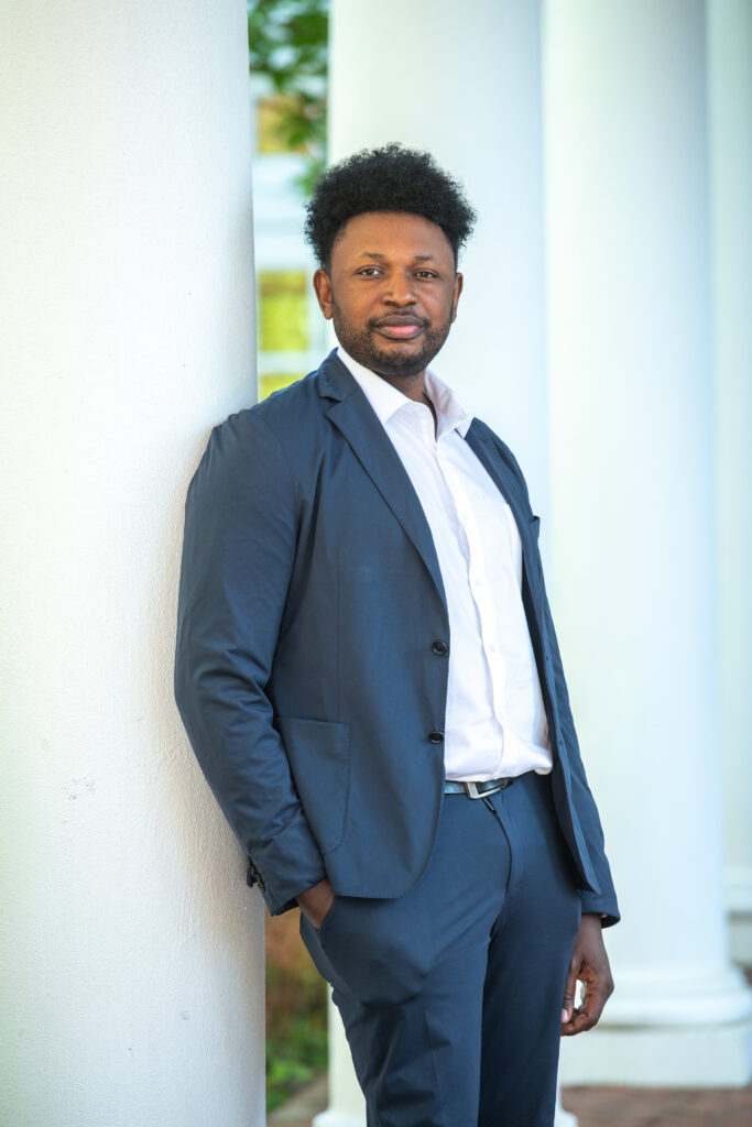 AlaSan Ceesay stands at UVA's Darden School of Business